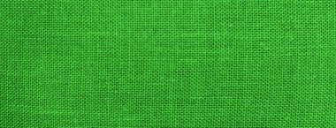  green background with a fabric texture
