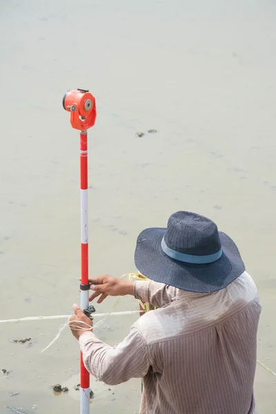 Man survey boundary of area — Stock Photo, Image