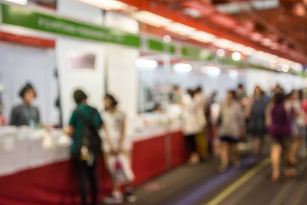 Abstract people walking in exhibition blurred background — Stock Photo, Image