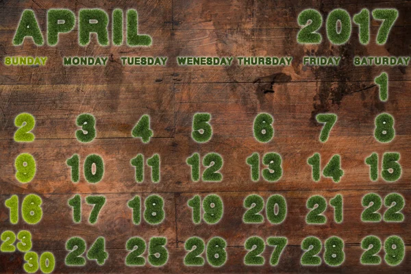 对木材的背景，3d 渲染上 4 月 2017 年日历 — 图库照片