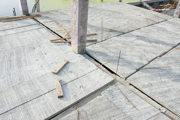 Concrete panels on floor at construction site — Stock Photo, Image