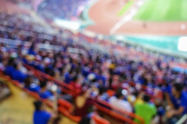 Fondo desenfocado de fútbol o estadio de fútbol en el crepúsculo, Tailandia —  Fotos de Stock