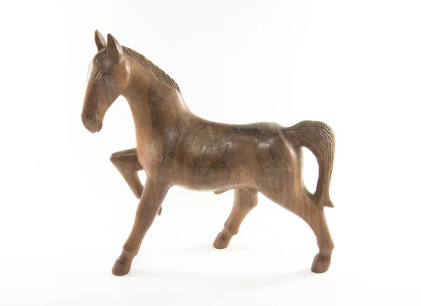 Cavalo de madeira está em um fundo branco — Fotografia de Stock