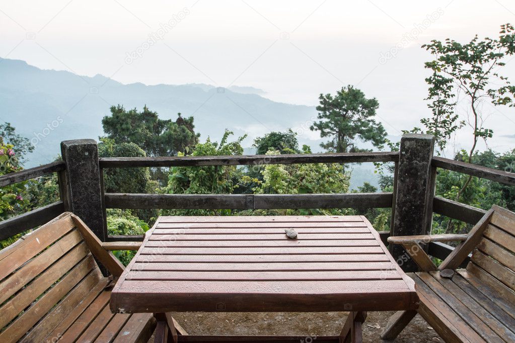 Wood chair and table on balcony inthe morning at Doi Tung, Chiang Rai
