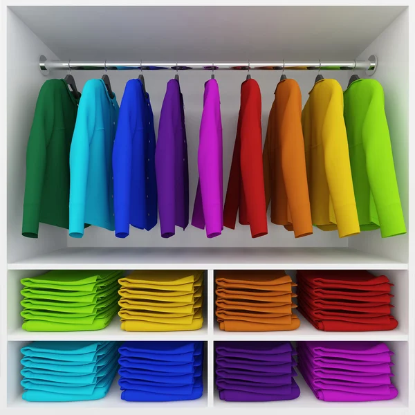 Ropa colorida colgando y pila de ropa en el armario — Foto de Stock