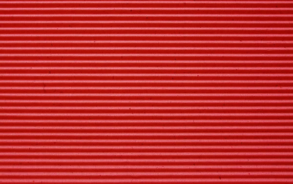 Red corrugated paper background. — Stock Photo, Image