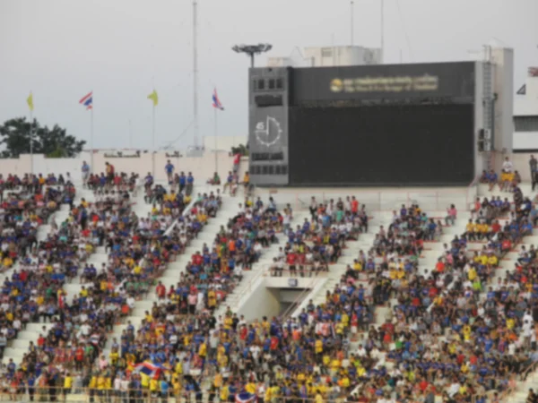 Fondo desenfocado de fútbol o estadio de fútbol en el crepúsculo, Tailandia —  Fotos de Stock