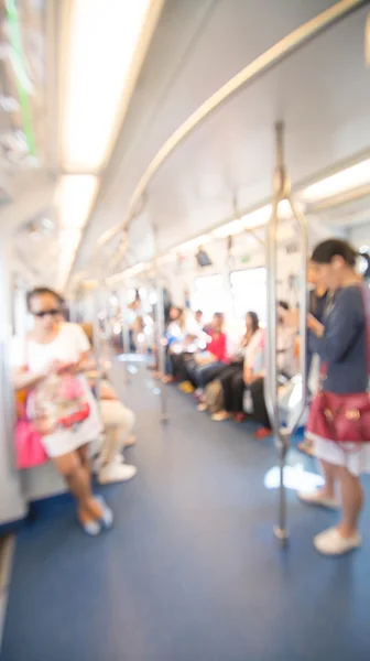 Blurred photo of passengers in sky train — Stock Photo, Image
