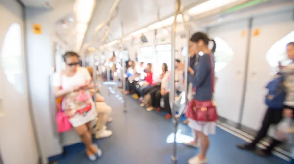 Blurred photo of passengers in sky train — Stock Photo, Image