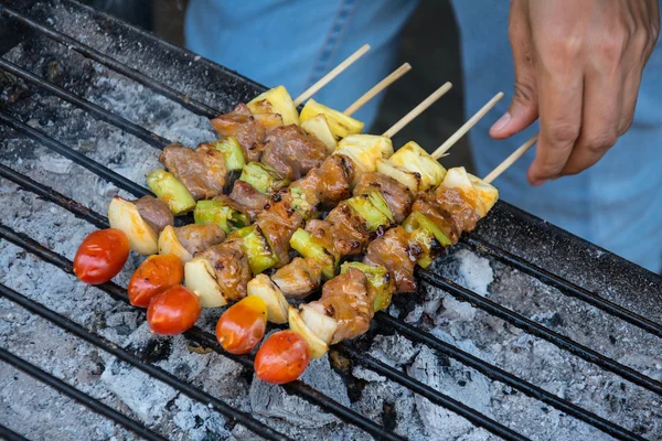 Bar-B-Q or BBQ  cooking. Coal grill of pork skewers with tomatoes, pineapple and peppers — Stock Photo, Image