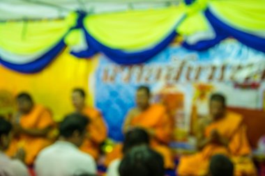 blur image of the monks and religious rituals in thai ceremony clipart
