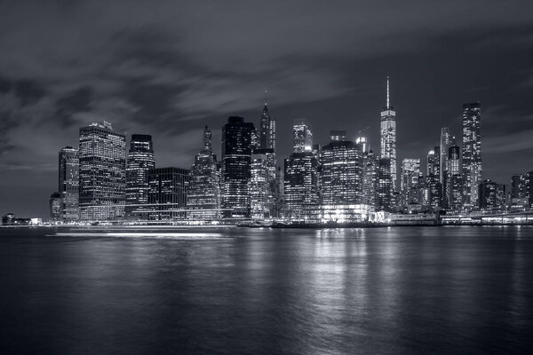 Panoramic view New York City Manhattan downtown skyline at night with skyscrapers