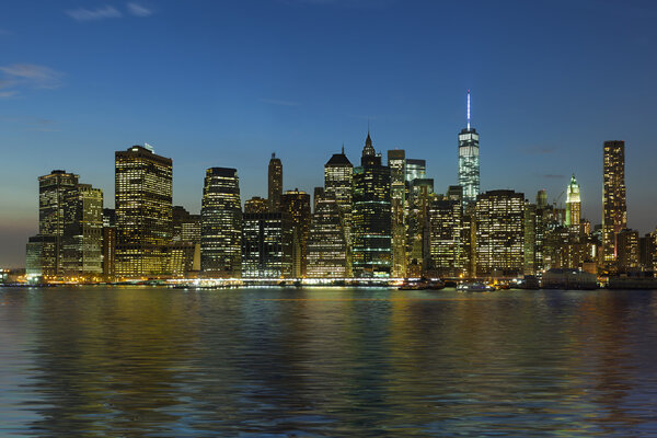 Panoramic view New York City Manhattan downtown skyline at night with skyscrapers