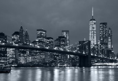 panorama new york city at night, brooklyn bridge and blue tonali clipart