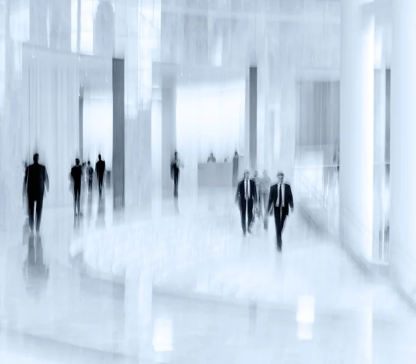 group of people in the lobby business center and blue tonality