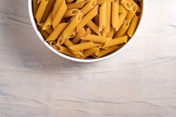 Raw Dry Uncooked Penne Pasta Bowl White Background Good Basil — Stock Photo, Image