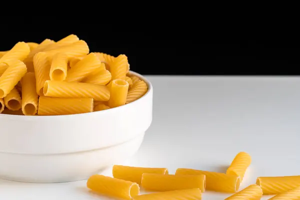 Raw Dry Uncooked Tortiglioni Pasta Spaghetti Noodle White Bowl Wooden — Stock Photo, Image