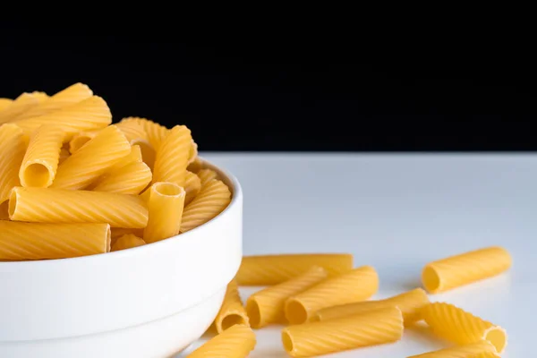 Raw Dry Uncooked Tortiglioni Pasta Spaghetti Noodle White Bowl Wooden — Stock Photo, Image