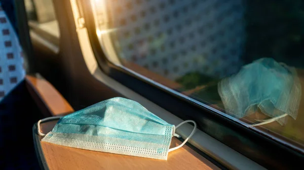 Empty inside train bus subway public transport with window view and blue seats people tourist new normal social distancing safe travel with hygiene face mask protect from covid corona virus