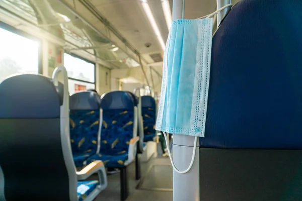 Empty inside train bus subway public transport with window view and blue seats people tourist new normal social distancing safe travel with hygiene face mask protect from covid corona virus