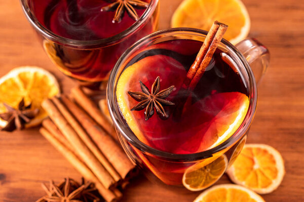 German tradition winter Christmas market new year holidays festival drink Gluhwein Mulled sweet hot warm red Wine with spices citrus aromatic cinnamon star anise