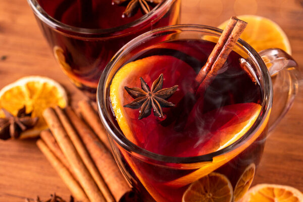 German tradition winter Christmas market new year holidays festival drink Gluhwein Mulled sweet hot warm red Wine with spices citrus aromatic cinnamon star anise