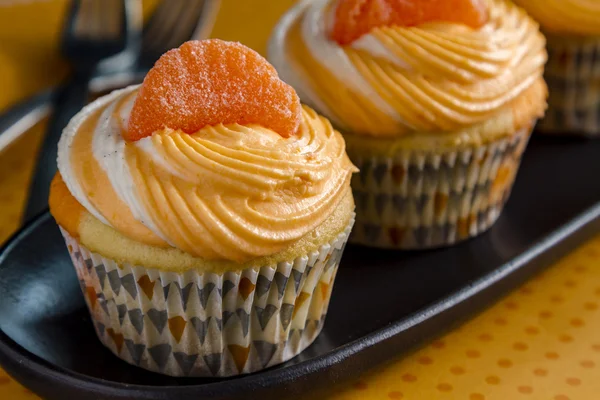 Oranje vanille boon wervelde Cupcakes — Stockfoto