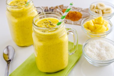 Pineapple, Banana, Coconut, Turmeric and Chia Seed Smoothies clipart
