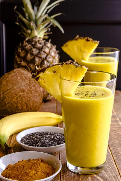 Pineapple, Banana, Coconut, Turmeric and Chia Seed Smoothies — Stock Photo, Image