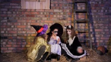 Girls in Halloween costumes come together