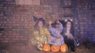 Halloween witches casting with pumpkins