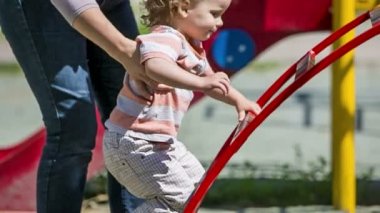 Boy climbing the ladder in the park