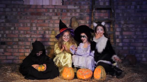 Children in Halloween costumes with pumpkins — Stock Video