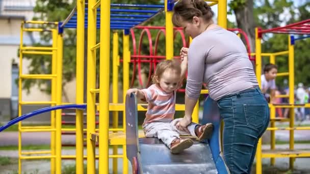 Mother with small son on playground. — 비디오