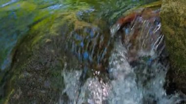 Stream Water Falling off Rock. Close-up shot with sound.