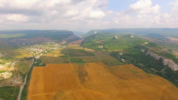 Birds Eye Scenery Of Hilly Locality And Harvest Field — Stock Video