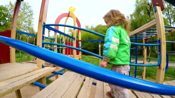 Happy Child Walking On Big Slide — Stock Video