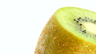 4K Cut Kiwi fruit isolated on white background, Three kiwi fruit, Close up. Rotating shot.