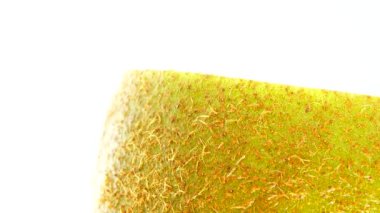 4K Cut Kiwi fruit isolated on white background, Three kiwi fruit, Close up. Rotating shot.