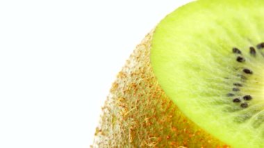 4K Cut Kiwi fruit isolated on white background, Three kiwi fruit, Close up. Rotating shot.