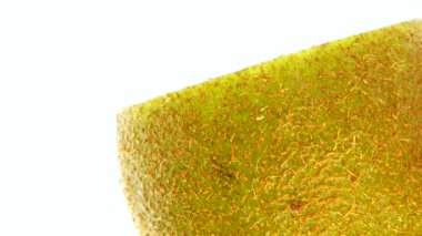 4K Cut Kiwi fruit isolated on white background, Three kiwi fruit, Close up. Rotating shot.