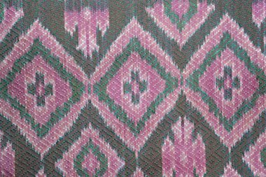 Kimyasal ücretsiz 60 yıldan daha eski renkli Tay Perulu stil halı yüzey eski vintage yırtık koruma Made doğal malzemelerden elişi yakın çekim.