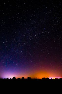 Night scenery with colorful and light yellow Milky Way Full of stars in the sky clipart