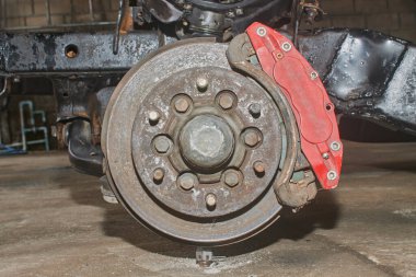 Car Wheel Hub and Brake System with Upper Arm Ball Joint and Chassis. Car Part or Auto Part in Car Repair Shop