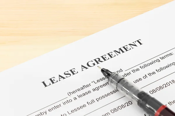 Lease Agreement Contract Document and Pen at Bottom Right Corner — 스톡 사진