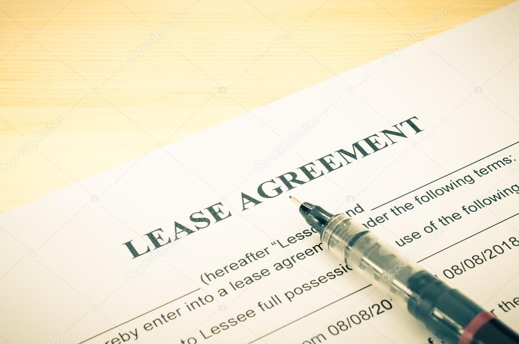 Lease Agreement Contract Document and Pen at Bottom Right Corner Vintage Style