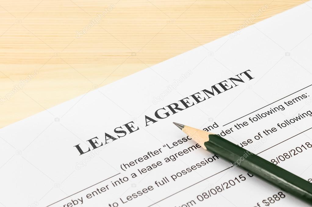 Lease Agreement Contract Document and Pencil at Bottom Right Corner