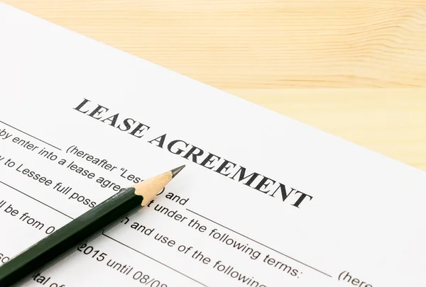 Lease Agreement Contract Document and Pencil Bottom Left Corner — Stock Photo, Image