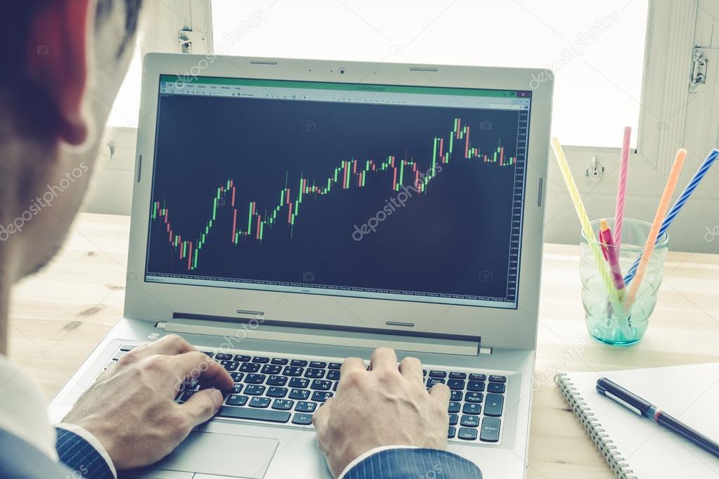 Businessman Analyze Stock Graph or Forex Graph by Laptop Vintage Style