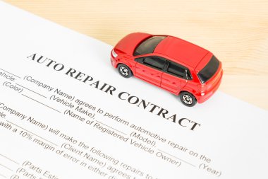 Auto Repair Contract With Red Car on Right View clipart